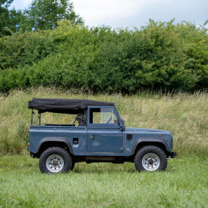 a land rover defender sat on silver steel wheels