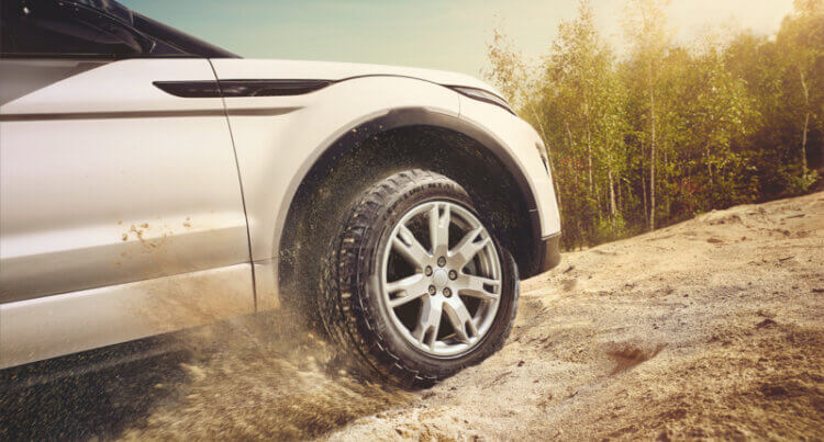 Continental 4x4 Contact tyre on a land rover moving up a dust track