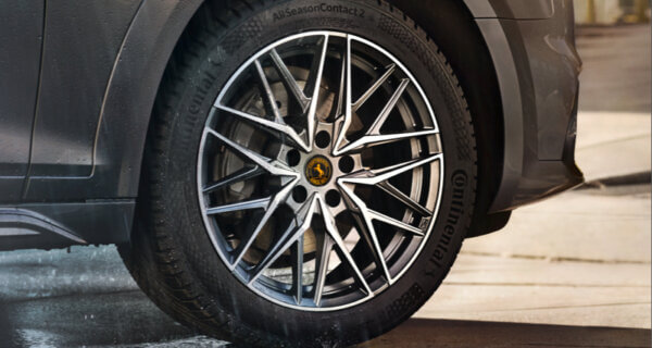 A Continental Tyres image of the AllSeasonContact 2 tyre sat on a spoked alloy wheel