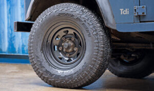 Classic blue land rover on tuff torque wheels