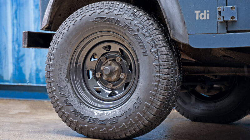 Classic blue land rover on tuff torque wheels