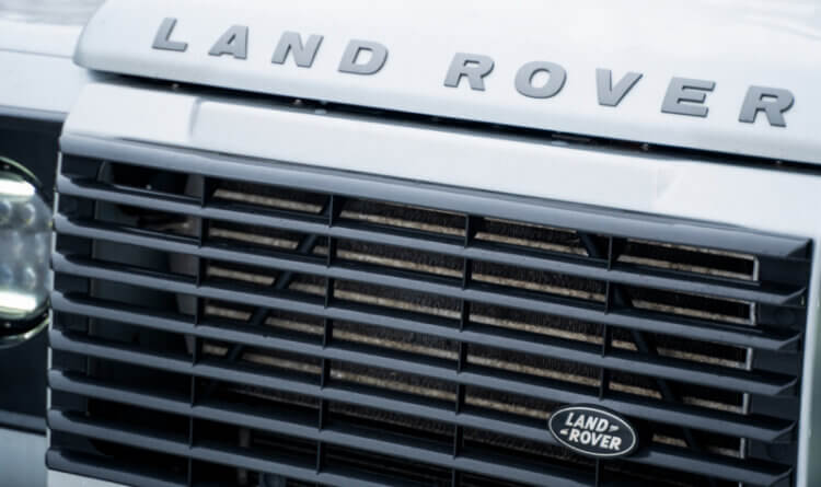close up of a land rover front badge