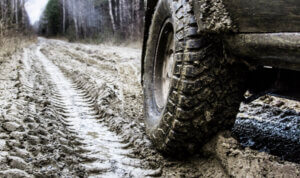 A 4x4 on heavy mud offloading sat on Mud Terrain Tyres