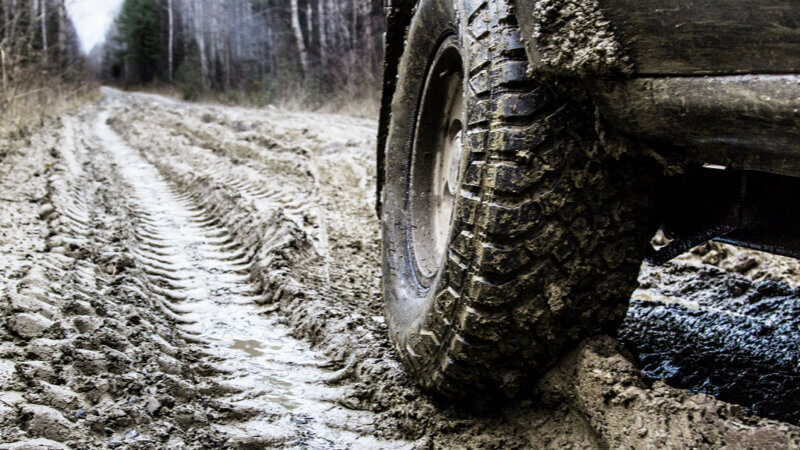 A 4x4 on heavy mud offloading sat on Mud Terrain Tyres