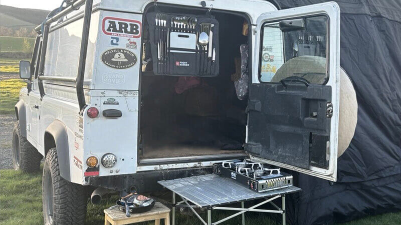 a land rover with its back door open ready to some cooking