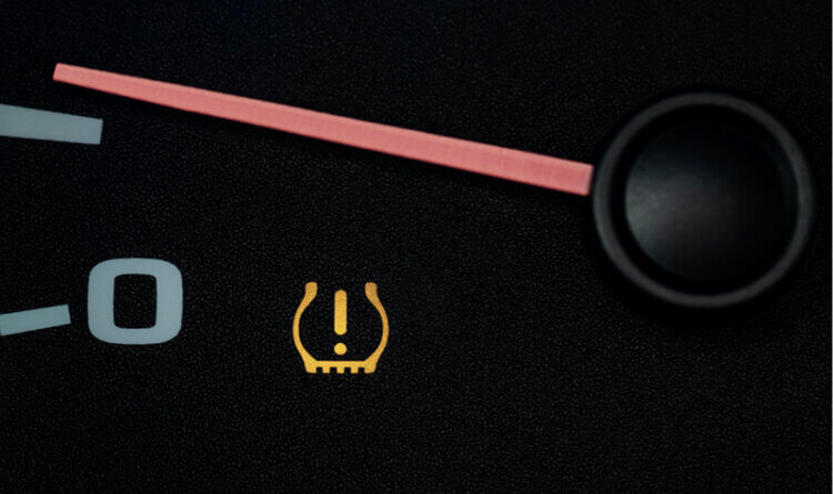 A tyre warning light on a car dash to illustrate tyre safety Importance-of Tyre Safety