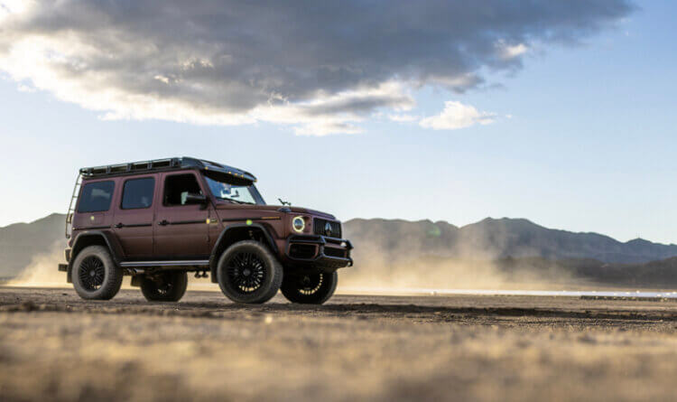 A Mercedes AMG G63 driving through a rugged terrain sat on General Grabber HTS60 summer tyres