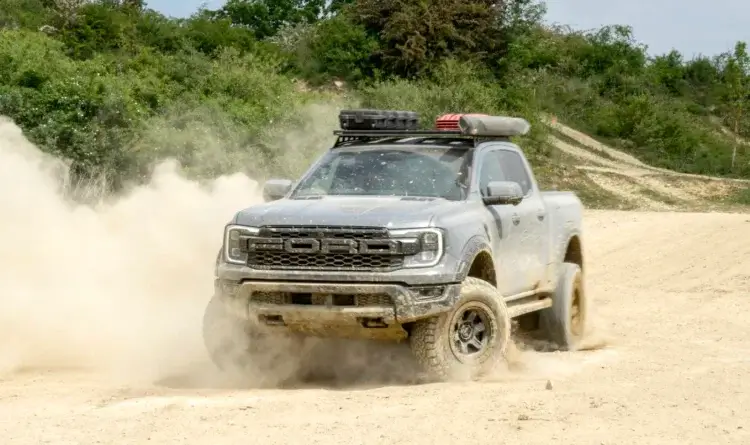 A modified Ford Ranger showing its mods on a 4x4 track