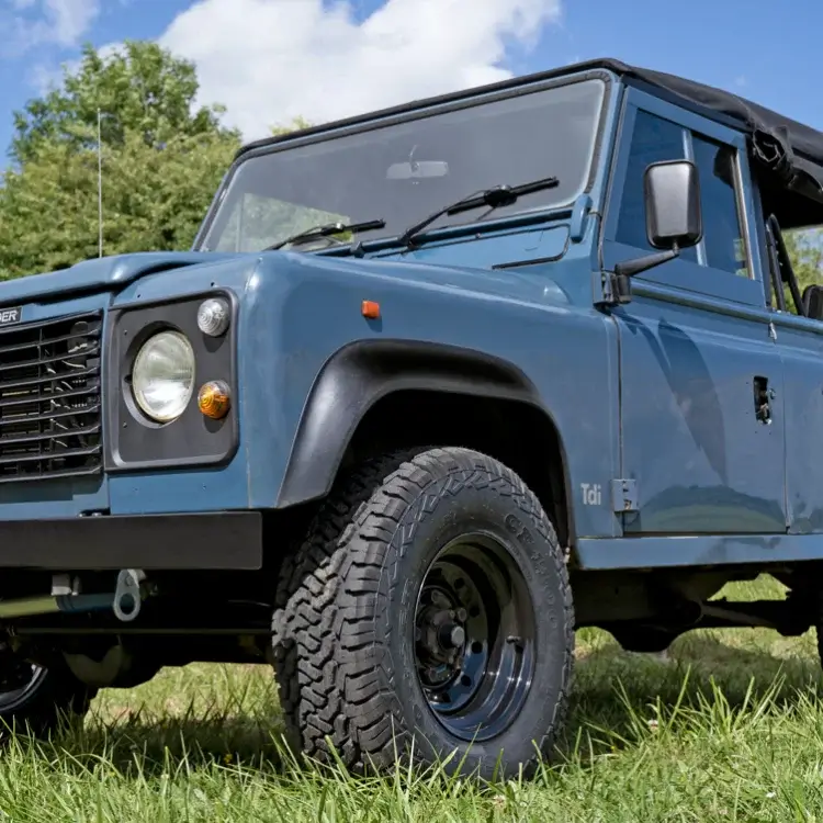tuff torque steel wheels sat on a vintage land rover