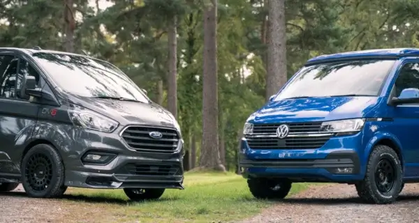 two vans facing each other sat on alloy and steel wheels