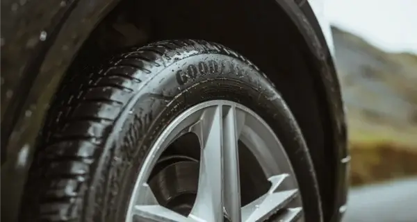 A goodyear tyre on a suv vehicle in the rain