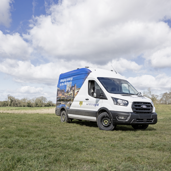 Ford Transit van fitted with General Grabber AT3 all-terrain tyres in a field