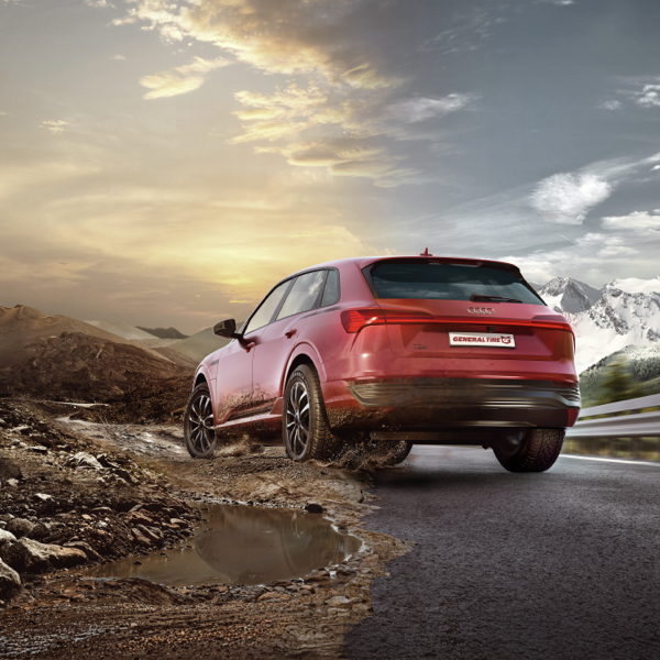 Red SUV fitted with General Grabber Cross A/S tyres on mixed road and off-road terrain