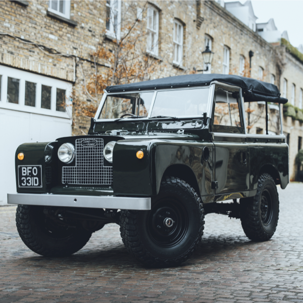 Classic Land Rover Series pickup fitted with rugged all-terrain BFG tyres and black steel wheels