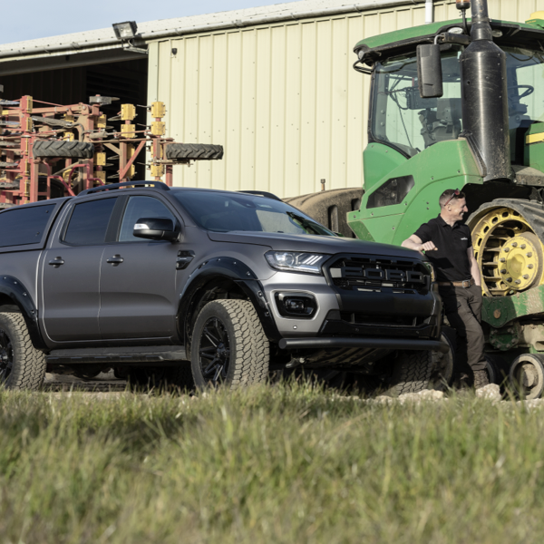 Ford Ranger fitted with General Grabber AT3 tyres parked beside farm machinery
