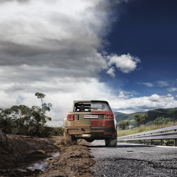 General Grabber X3 tyre transitioning from muddy off-road terrain onto a paved road