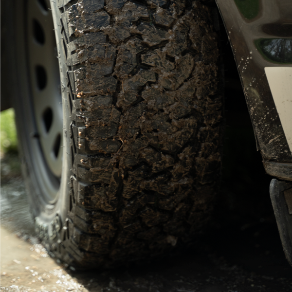 Close-up of muddy Comforser CF1100 tread after off-road driving