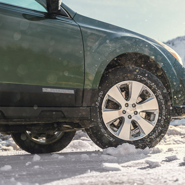 Subaru Outback fitted with BFGoodrich Trail-Terrain T/A tyres driving through snow