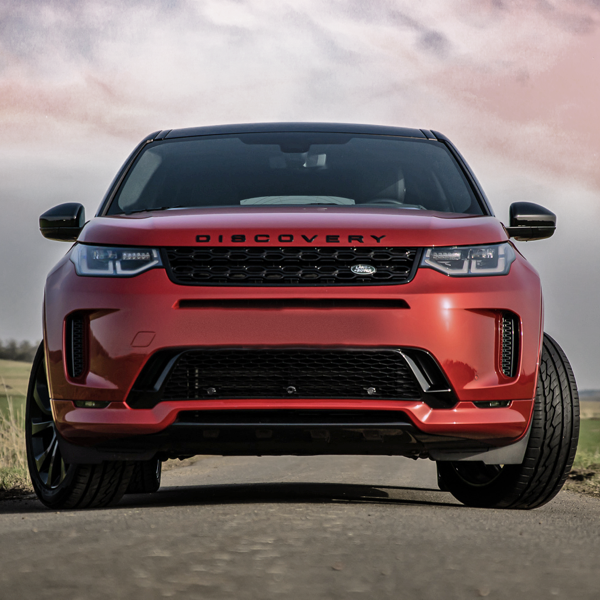Red Land Rover Discovery fitted with General Grabber GT Plus tyres on the road