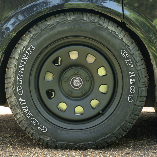 Close-up of Comforser CF1100 all-terrain tyre and steel wheel on a Volkswagen Transporter
