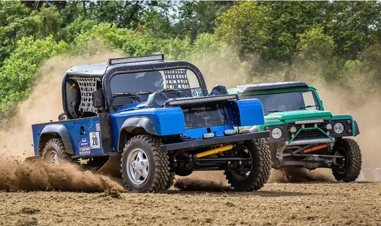 Team Broke’s blue number 67 88-inch Comp Safari car racing on a dirt course