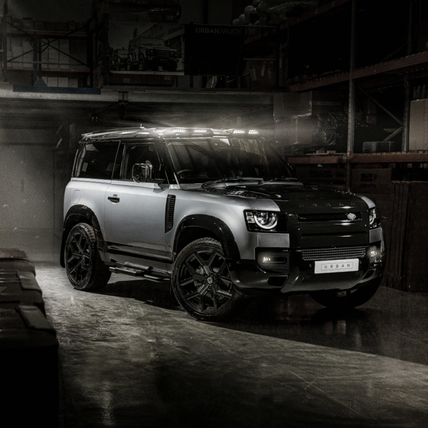 Grey Land Rover Defender fitted with black Urban WX-2 alloy wheels