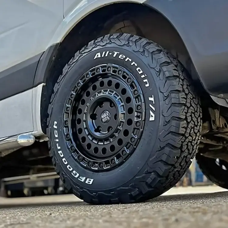 Close-up of a black Rogue alloy wheel fitted with a BFGoodrich All-Terrain T/A tyre on a van.