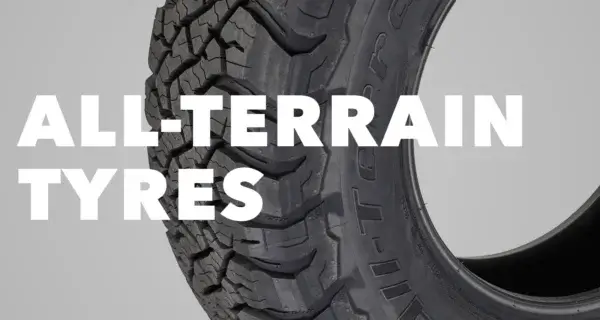 Close-up of an all-terrain tyre tread with “All-Terrain Tyres” text.