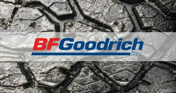Close-up of muddy tyre tread with the BFGoodrich logo.